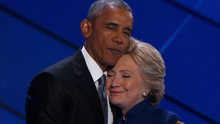 FILE PHOTO: President Barack Obama embrace Hillary Clinton during her campaign