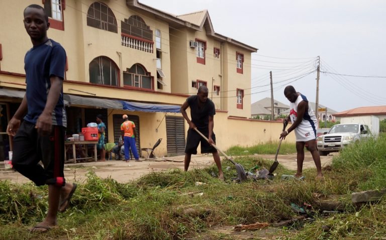 My friends and I clearing our surroundings while food vendors and logistics companies are about their business at 8:30am on Saturday
