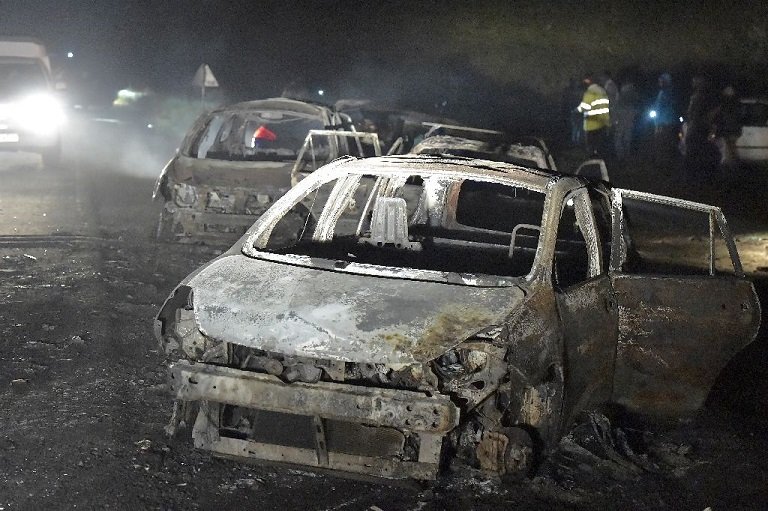 Vehicles damaged in the fuel tanker explosion Photo: AFP