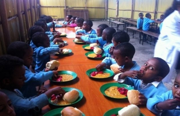 School Children eating Okpa