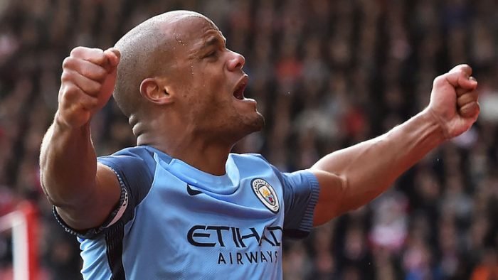 Vincent Kompany celebrates after scoring the opening goal of the game