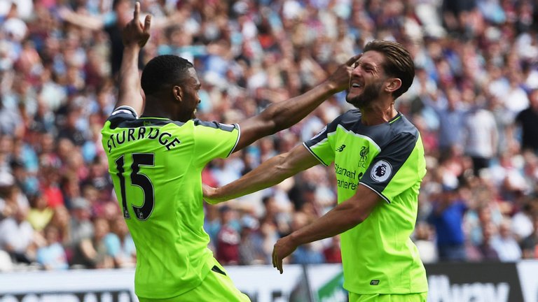 Danil Sturridge celebrates with Adam Lallana