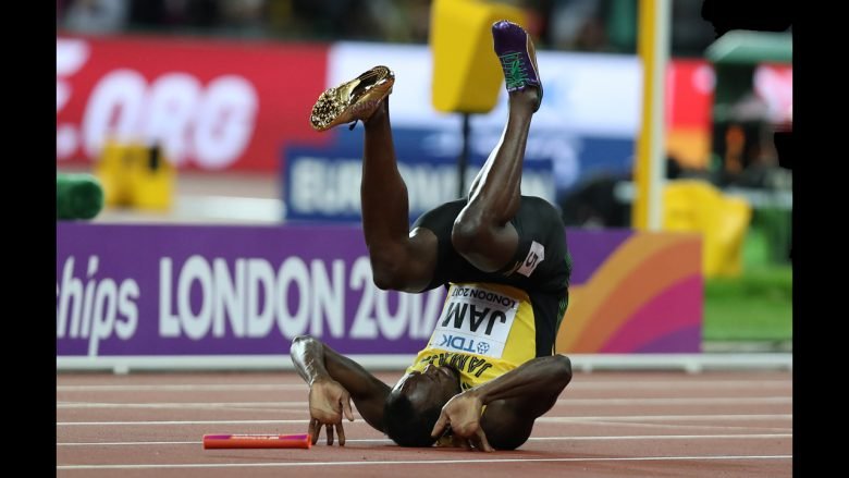 Jamaica’s Usain Bolt falls after injuring himself in the final of the men’s 4x100m relay