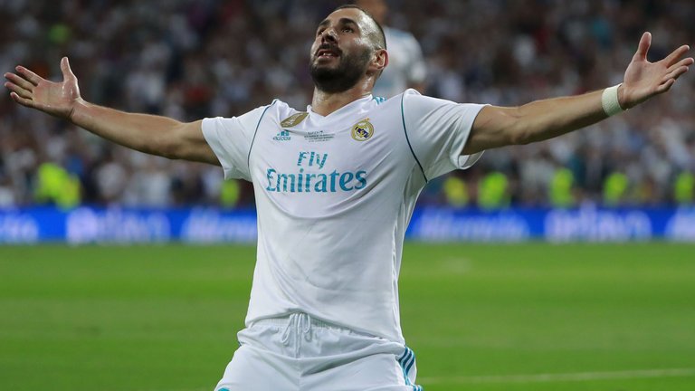 Karim Benzema celebrates after scoring the second goal of the evening