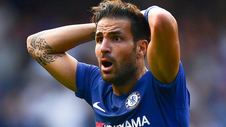 Cesc Fabregas reacts to being sent off