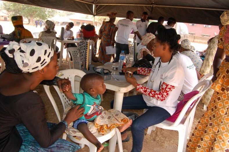 A child being attended to by a doctor during the Health Fair organised by Sen. Babajide Omoworare