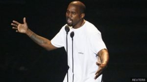 Kanye West performing on stage during a concert