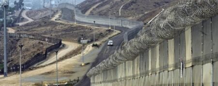 A border wall divides Nogales, Arizona from the Mexican state of Sonora