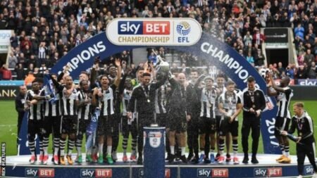 Newcastle seal championship title as Brighton slip up Newcastle players celebrate winning the Championship title