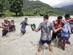 Rescue workers search through flood debris in Parun, Nuristan province, after deadly flash floods struck eastern Afghanistan.
