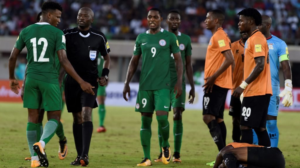 Botswanan referee Joshua Bondo (2L) speaks with Nigeria’s midfielder Abdullahi Shehu (L) during the FIFA World Cup 2018 qualifying football match between Nigeria and Zambia