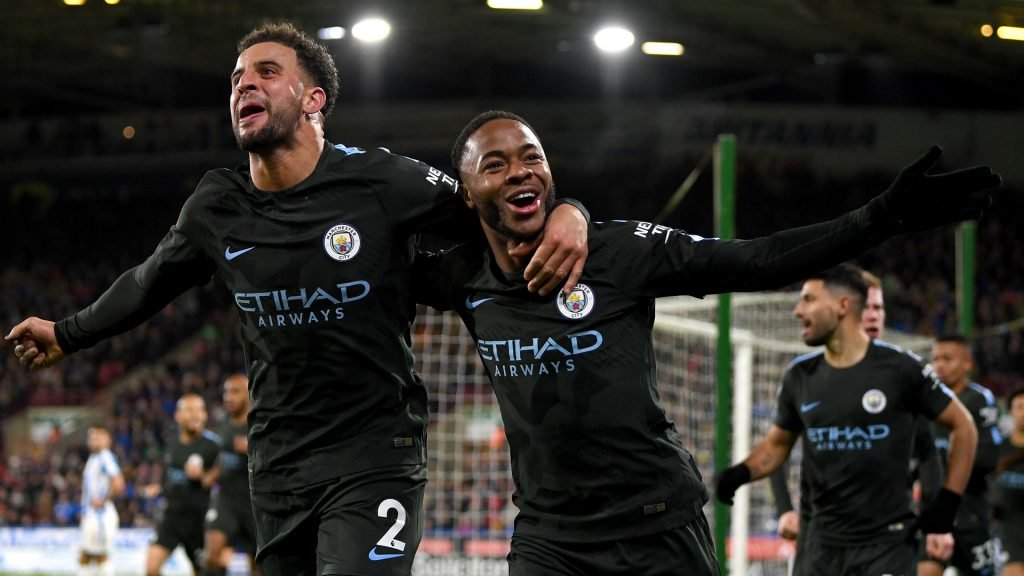 Huddersfield 1-2 Manchester City: Sterling preserves winning streak City players celebrates Sterling winner