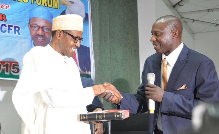 Presidential tribunal orders PDM to serve Buhari petition Pastor Habu Aminchi in a handshake with President Muhammadu Buhari in 2015