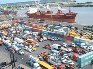 Containers and cargo ships at a Nigerian seaport symbolising new tariff reductions and 2026 fiscal policy changes