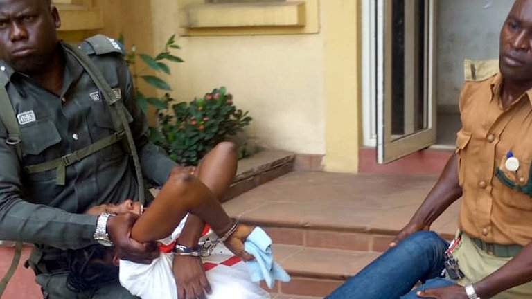 Woman collapses in court after given death sentence Woman being carried out of the court