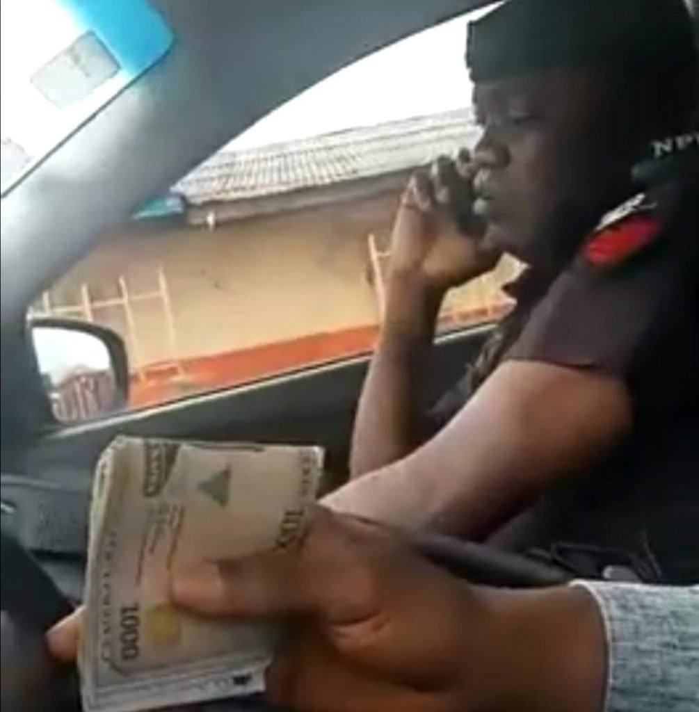 The police officer collecting bribe