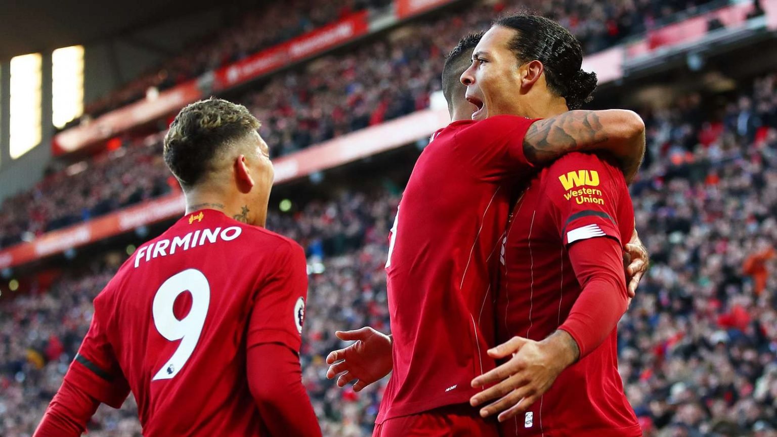 Liverpool’s 31-game run sees title-chasing Reds match top-flight record Liverpool celebrate