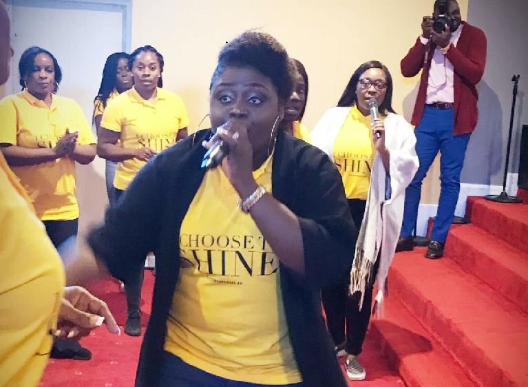 Tobiloba mininstering in a church in London, UK