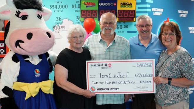 US Powerball lottery shared after 1992 handshake Tom, centre, and Joe (right) are pictured with their wives after scooping the Powerball jackpot