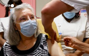 Elderly woman taking covid vaccine
