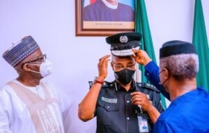 Vice President Yemi Osinbajo SAN decorates the new Acting Inspector General of the Nigerian Police Force Usman Alkali Baba at the State House, Abuja. 7th April, 2020. Photos; Tolani Alli