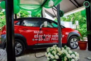 Electric vehicles charging at a solar-powered station in Nigeria