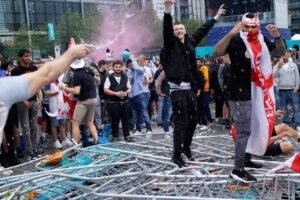 Nine police officers were hurt, and a child was struck by a bottle before a football game in south Belfast on Friday night.