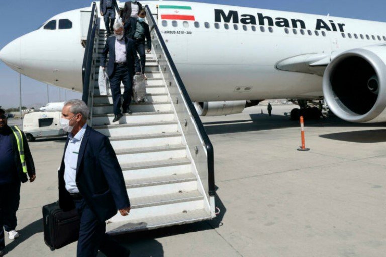 Passengers get off from a privately owned Iranian airline Mahan Air flight at the airport in Kabul on September 15, 2021 Afghanistan