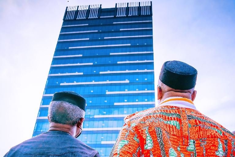 Vice President Yemi Osinbajo and Governor Udom Emmanuel looking at the imposing 21-storey Dakkada Tower