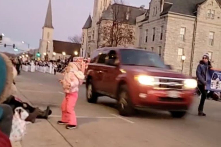 Many killed as vehicle rams into christmas parade in US A red SUV is seen speeding through the christmas parade crowd in the city of Waukesha, Wisconsin via a video screen shot taken from the city's Facebook live streaming on November 21, 2021