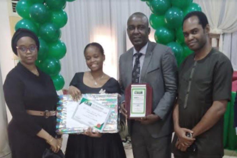 Chrisland student wins Sidmach Award L-R: Mrs Kasim, Mother; Kasim Haneefa Olayemi, Winner Sidmach Prize, Mr Kasim, Father and Mr Jide Onigbogi, Principal, Chrisland High School VGC during the presentation of awards in Lagos.
