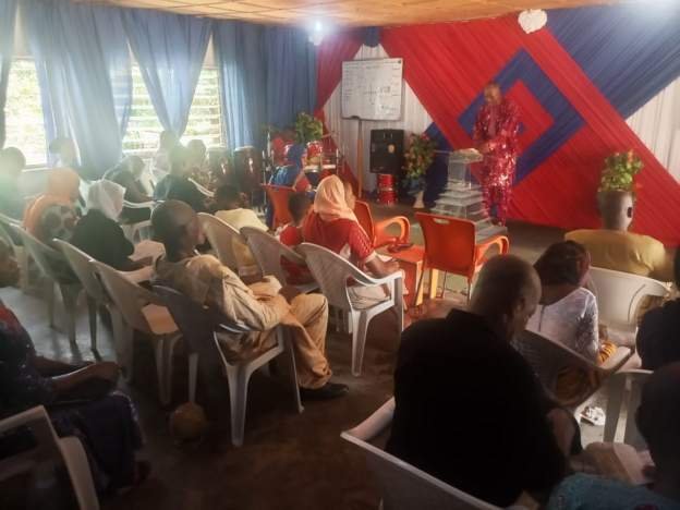 Pastor Ade dressed in Red