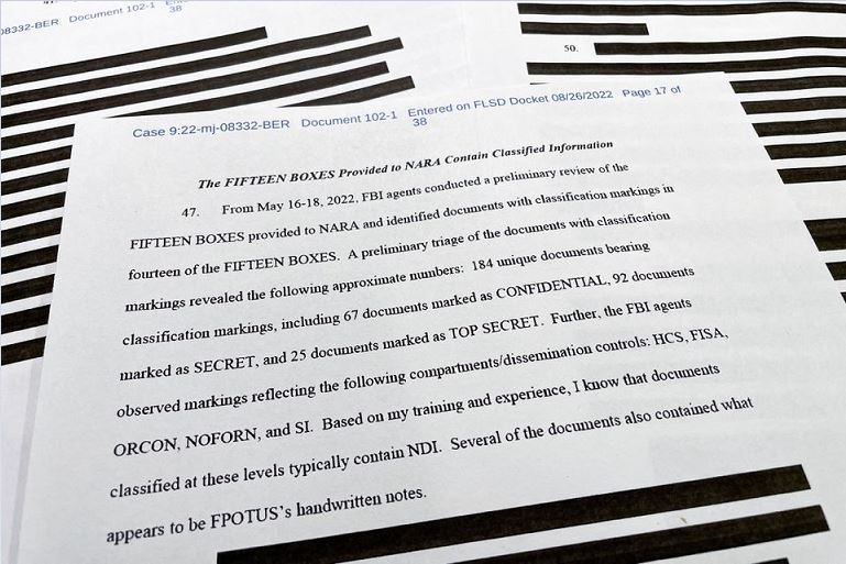 The 17th page of the redacted version of an affidavit that the U.S. Justice Department submitted to a federal judge to support the execution of a search warrant by the FBI at former President Donald Trump's Mar-a-Lago estate shows a list of the classification markings found on documents returned in 15 boxes to the National Archives by Trump including "184 unique documents bearing classification markings, including 67 documents marked as CONFIDENTIAL, 92 documents marked as SECRET, and 25 documents marked as TOP SECRET" after the affidavit was released by the U.S. District Court for the Southern District of Florida in West Palm Beach, Florida, U.S. August 26, 2022. REUTERS/Jim Bourg