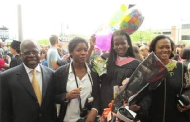 Habibat Tinubu standing next to her father