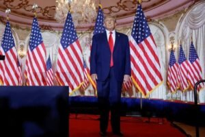 Former US President Donald Trump stands onstage listening to applause as he arrives to announce that he will once again run for US president in the 2024 US presidential election during an event at his Mar-a-Lago estate in Palm Beach, Florida, US REUTERS