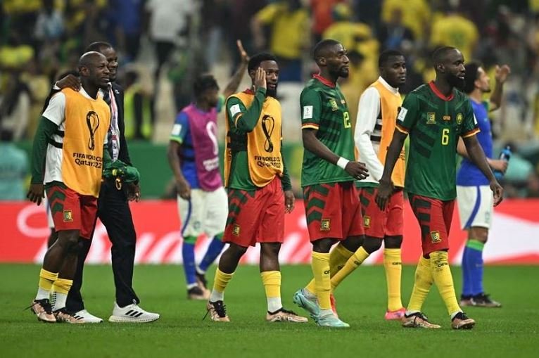 Cameroon's Nicolas Moumi Ngamaleu with teammates at the World Cup