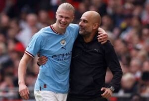 Erling Haaland with manager Pep Guardiola after being substituted Action Images via Reuters/Jason Cairnduff TPX