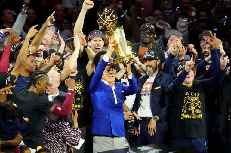 Denver Nuggets owner Stan Kroenke lifts the Larry O'Brien Trophy after the Nuggets won the 2023 NBA Championship