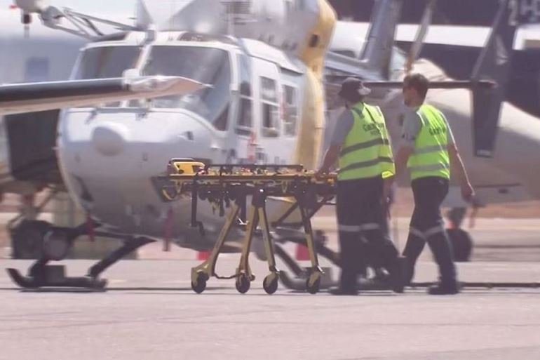 Three US Marines die in Australia aircraft crash Paramedics push a stretcher following US Marines military aircraft crash in Darwin, Australia, August 27, 2023 in this screen grab obtained from a handout video. AUSTRALIAN BROADCASTING CORPORATION/via Reuters TV/Handout via REUTERS