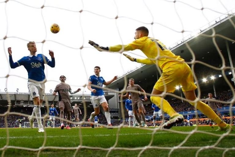 Everton's Jarrad Branthwaite scores their second goal past Tottenham Hotspur's Guglielmo Vicario