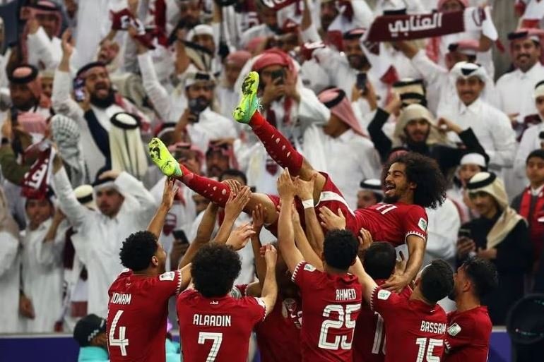 Qatar's players celebrate with Akram Afif after winning the AFC Asian Cup