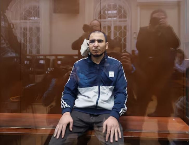 Saidakrami Murodali Rachabalizoda, a suspect in the shooting attack at the Crocus City Hall concert venue, sits inside behind a glass wall of an enclosure for defendants at the Basmanny district court in Moscow, Russia March 24, 2024/REUTERS