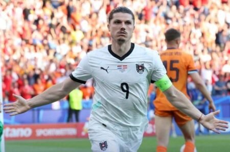 Marcel Sabitzer wheels away after putting Austria ahead against Netherlands in Leipzig
