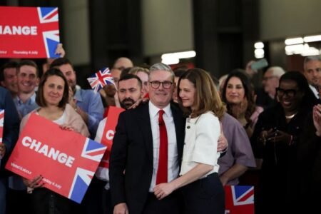 Keir Starmer: Who is UK’s new PM and what did he promise? Keir Starmer, leader of Britain's Labour Party and his wife Victoria Starmer attend a reception to celebrate Starmer's win in the election, at Tate Modern, in London, Britain, July 5, 2024. REUTERS/Suzanne Plunkett