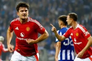 Harry Maguire celebrates scoring Man United equalising goal in injury time