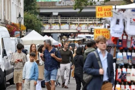 Shoppers walk along Portobello Road at Notting Hill in London, Britain, July 12, 2024. REUTERS/Hollie Adams/File Photo Purchase Licensing Rights UK