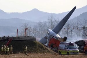 Firefighters and rescue team members work at Muan International Airport in Muan, South Korea, Sunday, Dec. 29, 2024. (Cho Nam-sooYonhap via AP)