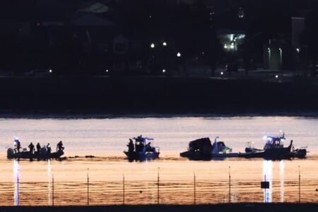 Rescuers work the site of the crash after a Black Hawk helicopter collided with the American Eagle flight 5342 operated by PSA Airlines, an Ohio-based regional subsidiary of American Airlines. PHOTO: Reuters