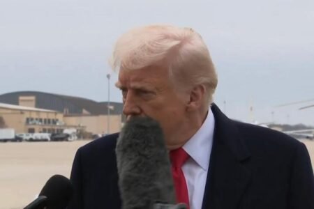 Trump hit in the face by microphone