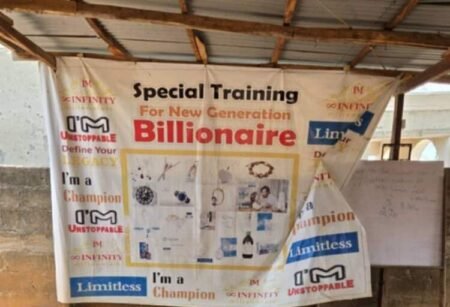 Quest International University: EFCC arrests masterminds of Q-net scam Q-net University banner hangs outside Compensation Layout, Gwagwalada, FCT, Abuja